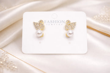 Boucles d’oreilles en forme de cygne avec perle blanche