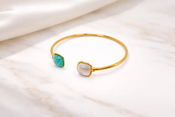 Bracelet jonc doré avec deux pierres décoratives